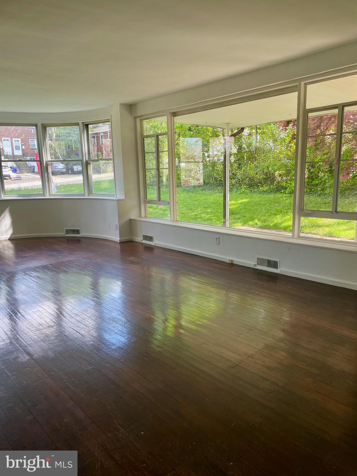 119 Robbins Avenue Jenkintown, PA 19046 - Photo 4 of 65 a view of empty room with wooden floor and fan