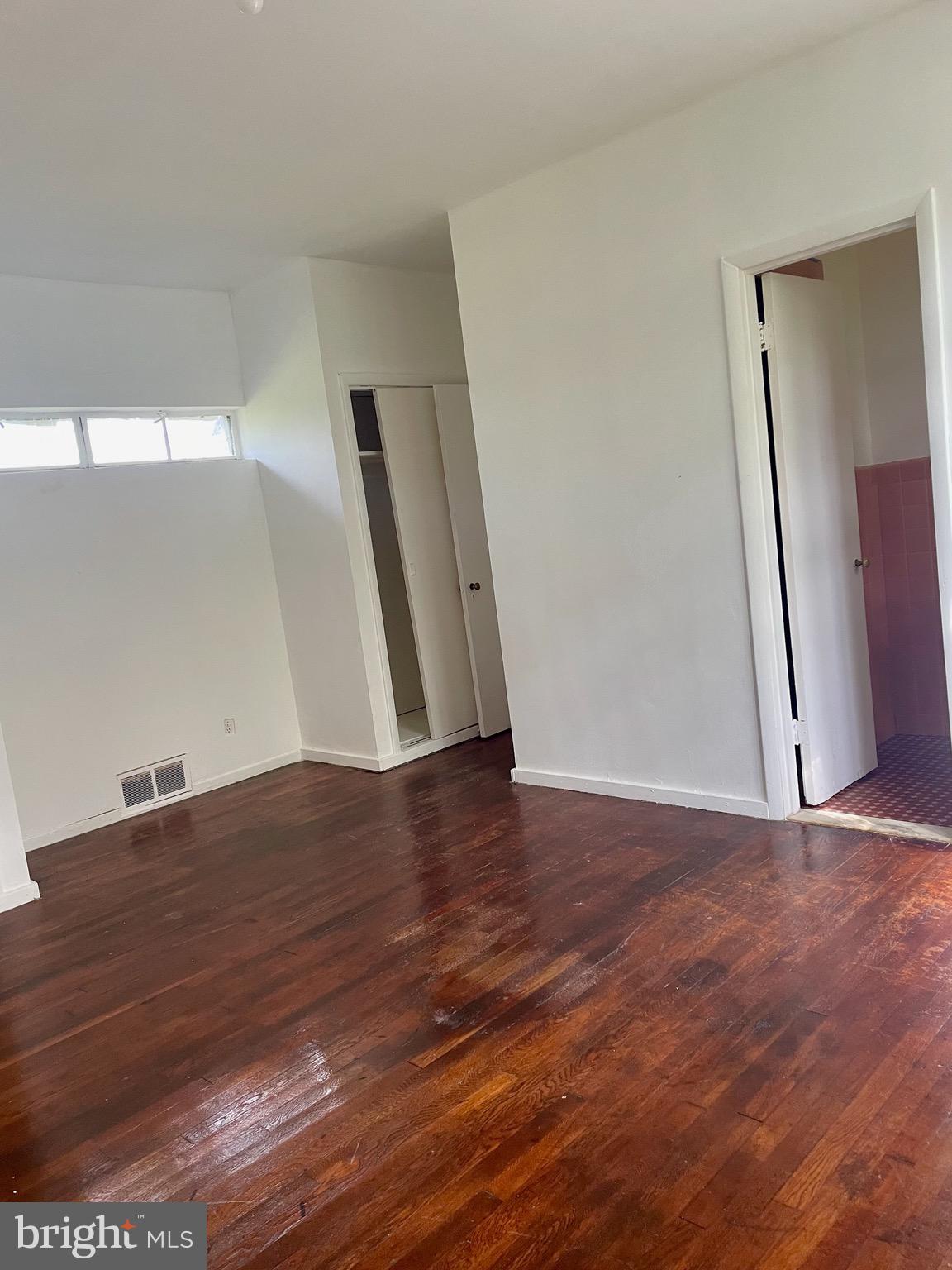 119 Robbins Avenue Jenkintown, PA 19046 - Photo 59 of 65 an empty room with wooden floor and window
