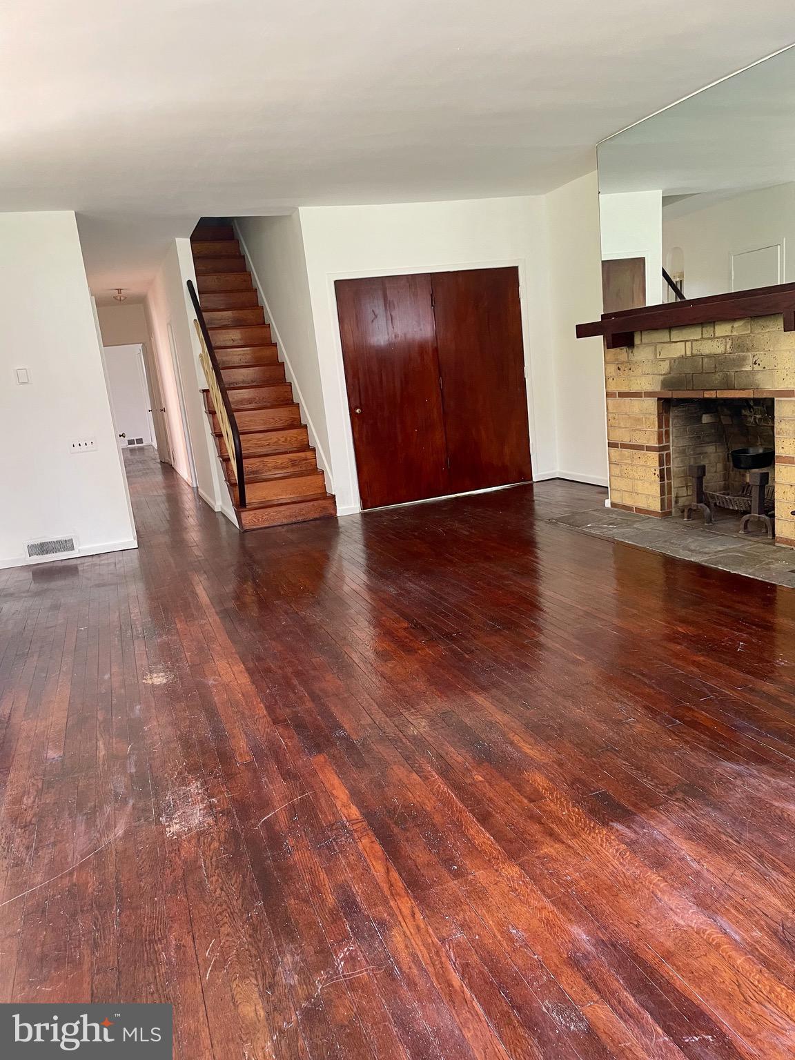 119 Robbins Avenue Jenkintown, PA 19046 - Photo 6 of 65 a view of a livingroom with wooden floor and a fireplace