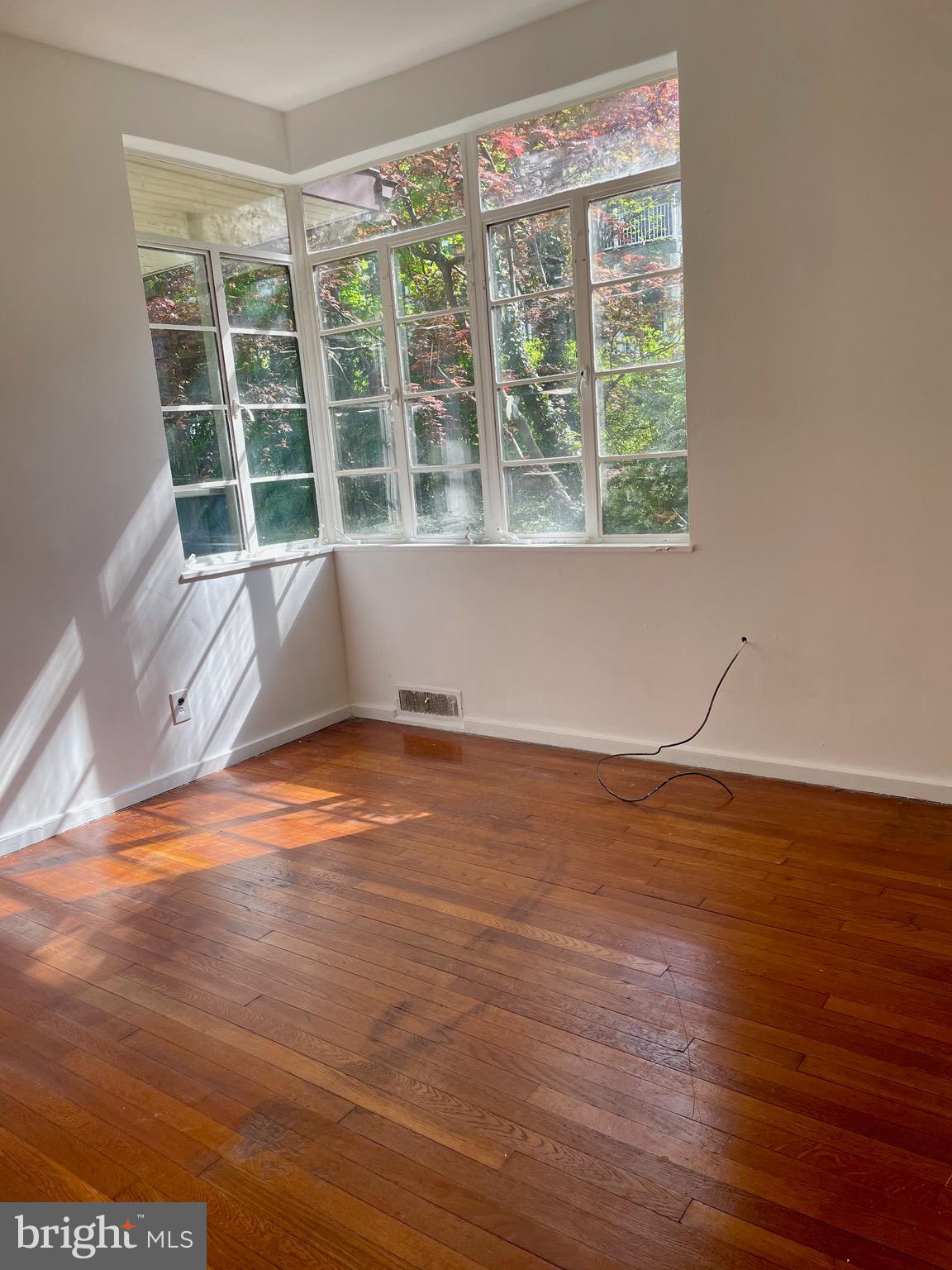 119 Robbins Avenue Jenkintown, PA 19046 - Photo 61 of 65 a view of wooden floor and windows in a room