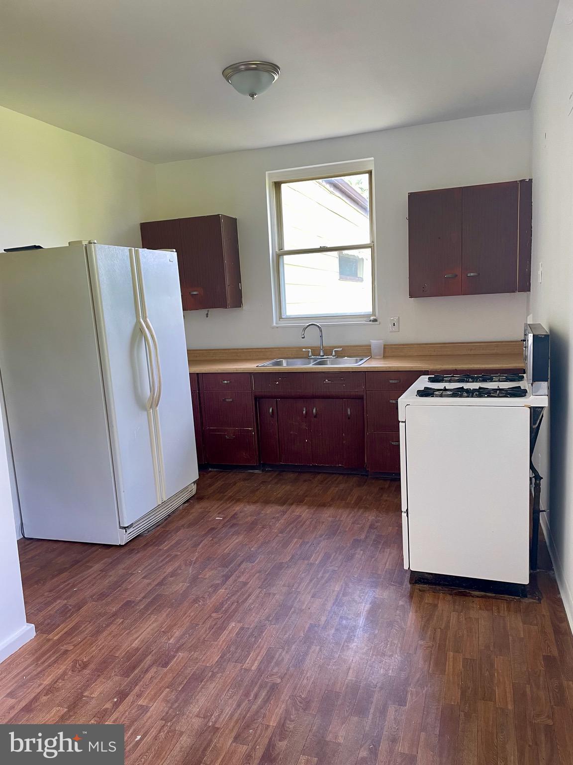 119 Robbins Avenue Jenkintown, PA 19046 - Photo 10 of 65 a room with wooden cabinets and sink