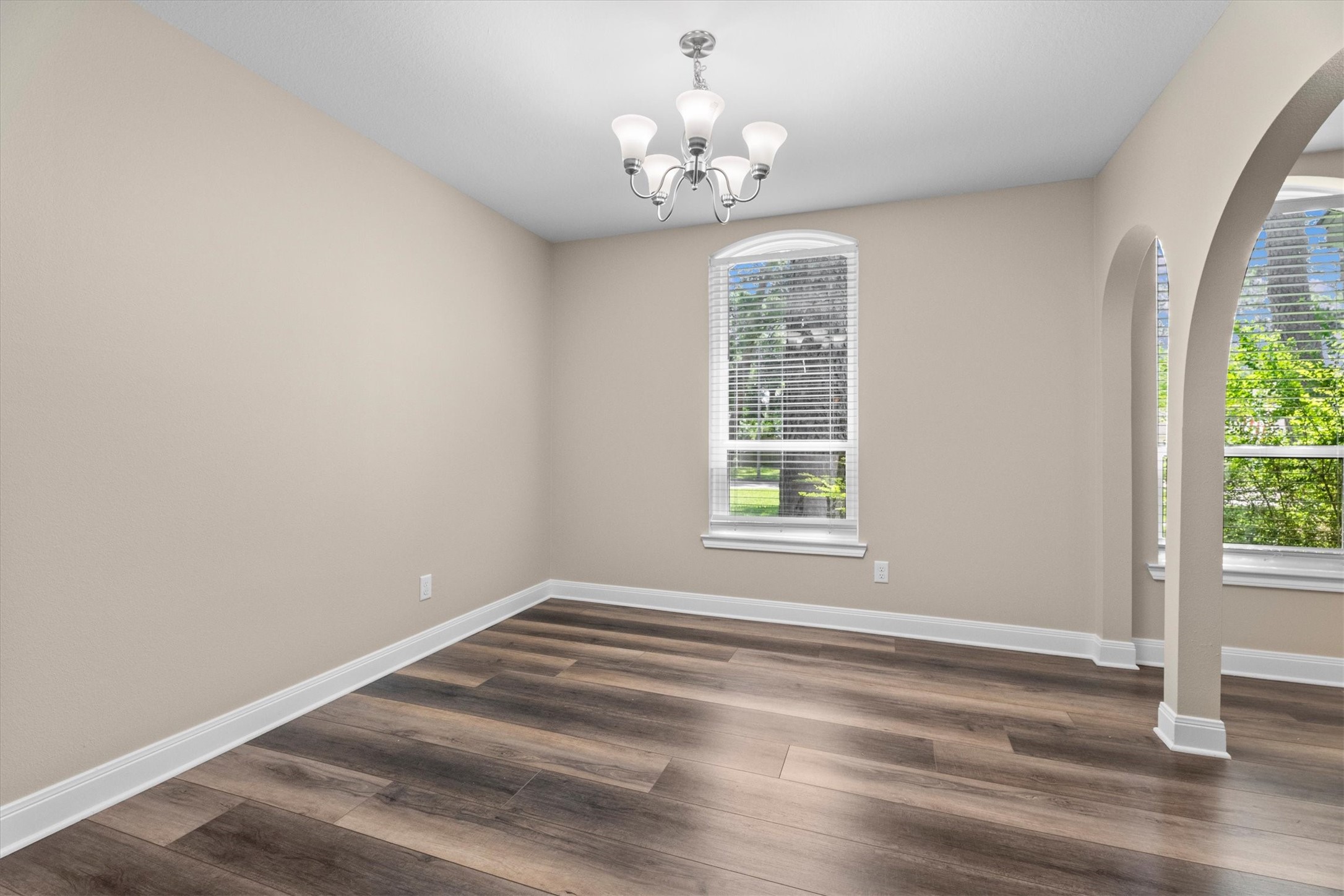 6530 Bayonne Drive Spring, TX 77389 - Photo 14 of 37 an empty room with wooden floor and windows