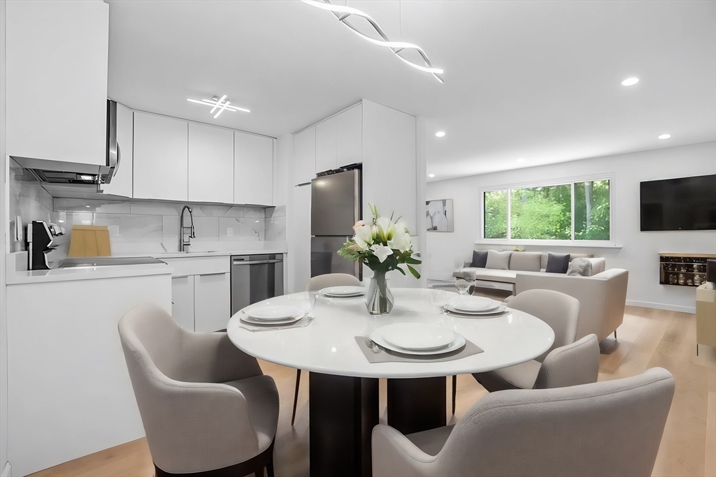75 Nicholas Road, Unit K Framingham, MA 01701 - Photo 1 of 24 a view of kitchen with furniture dining table and chairs