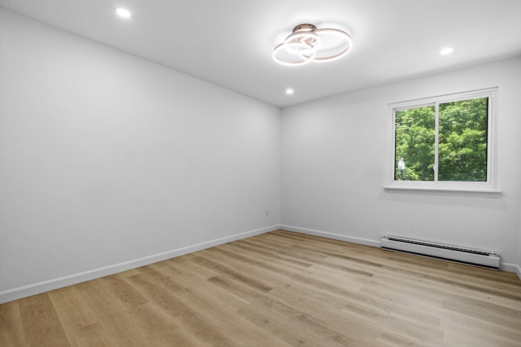 75 Nicholas Road, Unit K Framingham, MA 01701 - Photo 19 of 24 an empty room with a window