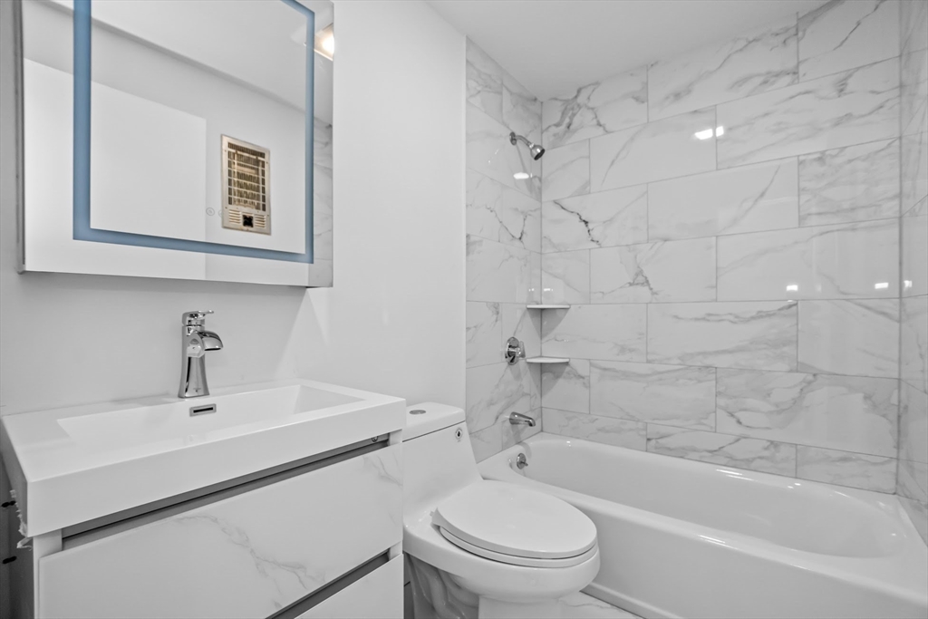 75 Nicholas Road, Unit K Framingham, MA 01701 - Photo 20 of 24 a bathroom with a sink toilet and shower