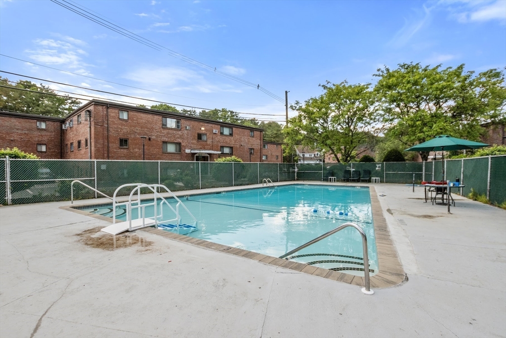 75 Nicholas Road, Unit K Framingham, MA 01701 - Photo 21 of 24 a view of a swimming pool with a patio
