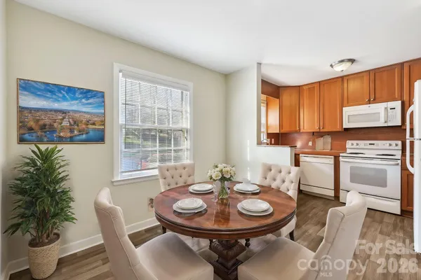 a kitchen with a table and chairs