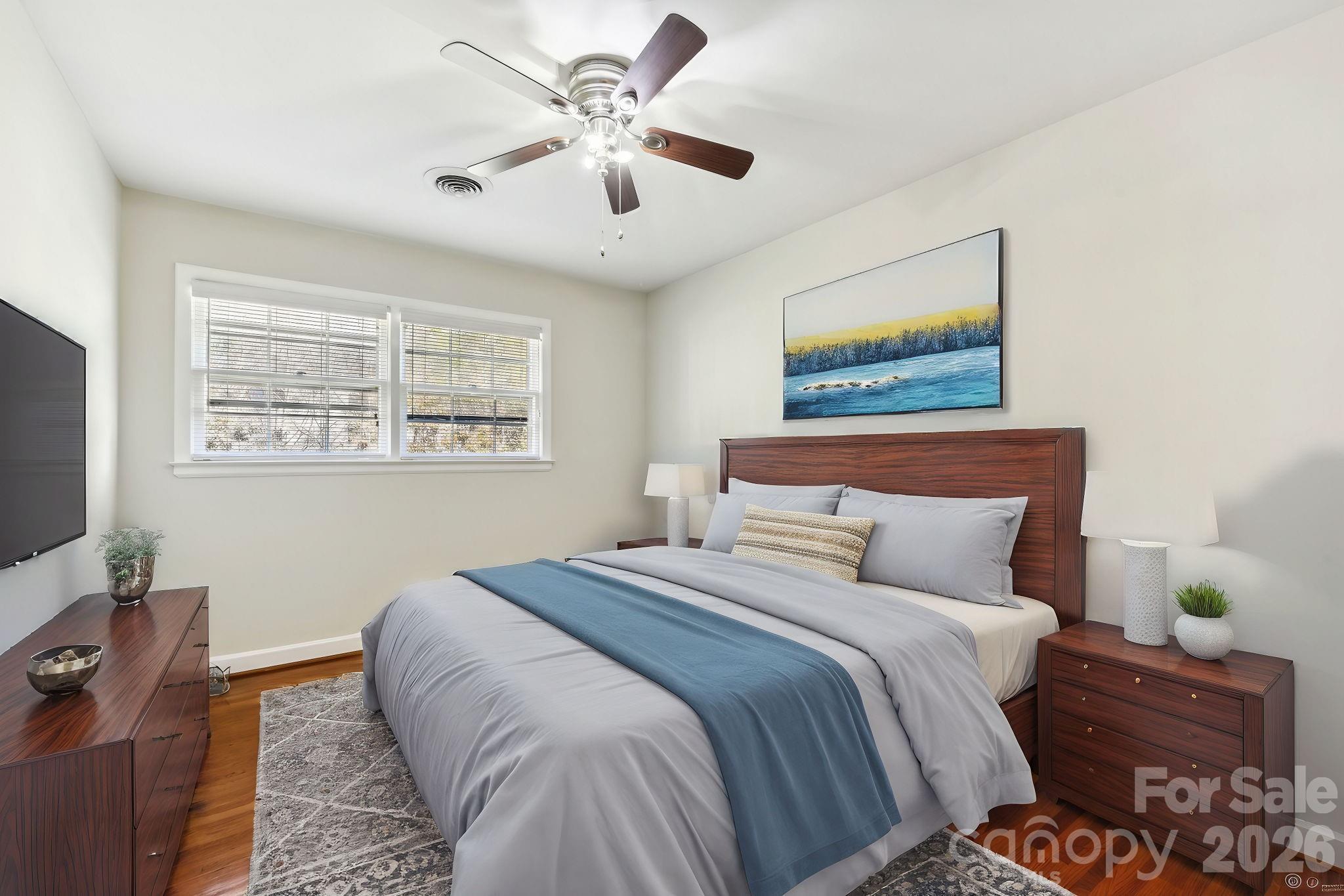 1334 Briar Creek Road, Unit 2 Charlotte, NC 28205 - Photo 12 of 30 a bedroom with a bed and a television