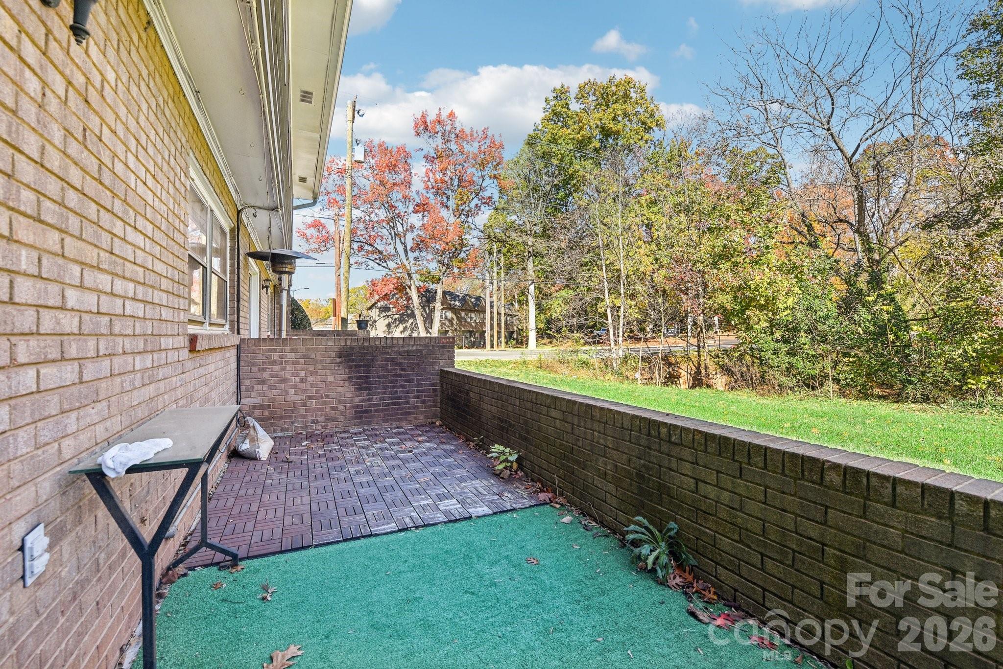 1334 Briar Creek Road, Unit 2 Charlotte, NC 28205 - Photo 26 of 30 a view of a backyard with wooden fence