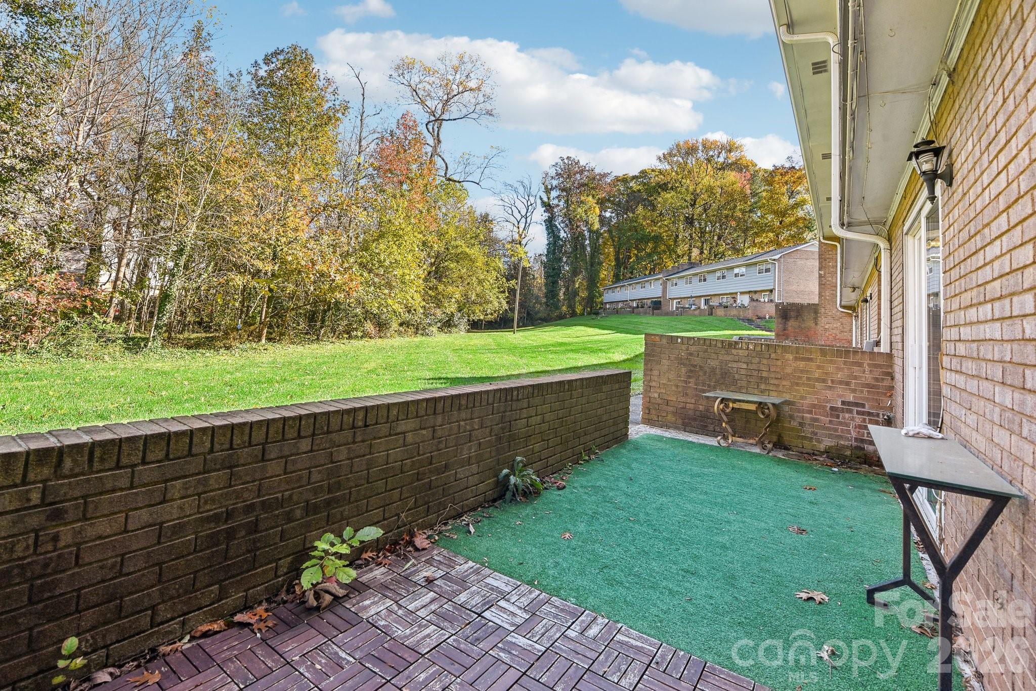 1334 Briar Creek Road, Unit 2 Charlotte, NC 28205 - Photo 27 of 30 a view of a garden with an outdoor space