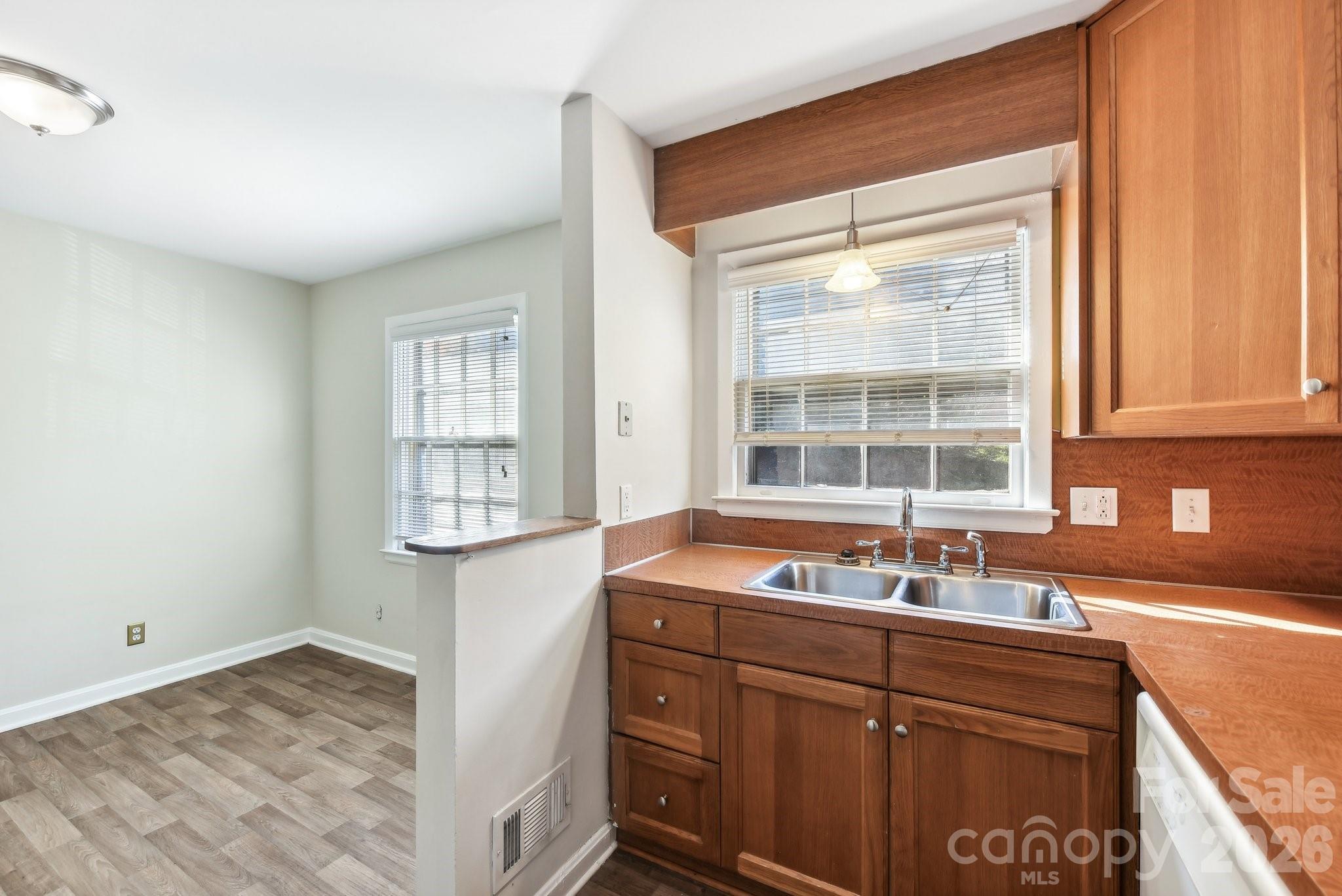 1334 Briar Creek Road, Unit 2 Charlotte, NC 28205 - Photo 7 of 30 a kitchen with a sink and large window