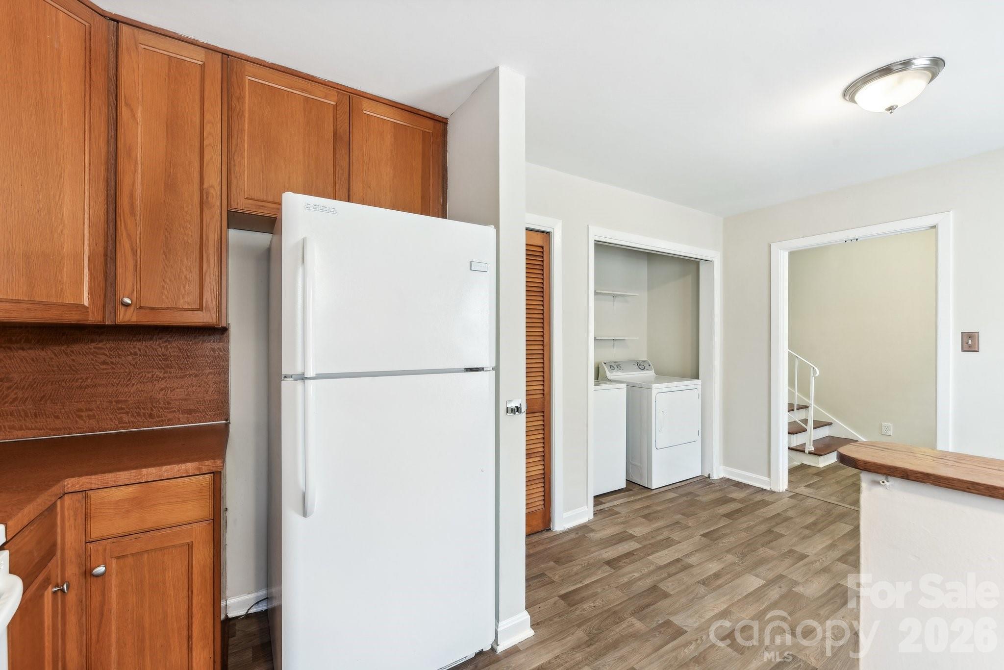 1334 Briar Creek Road, Unit 2 Charlotte, NC 28205 - Photo 8 of 30 a white refrigerator freezer sitting in a kitchen