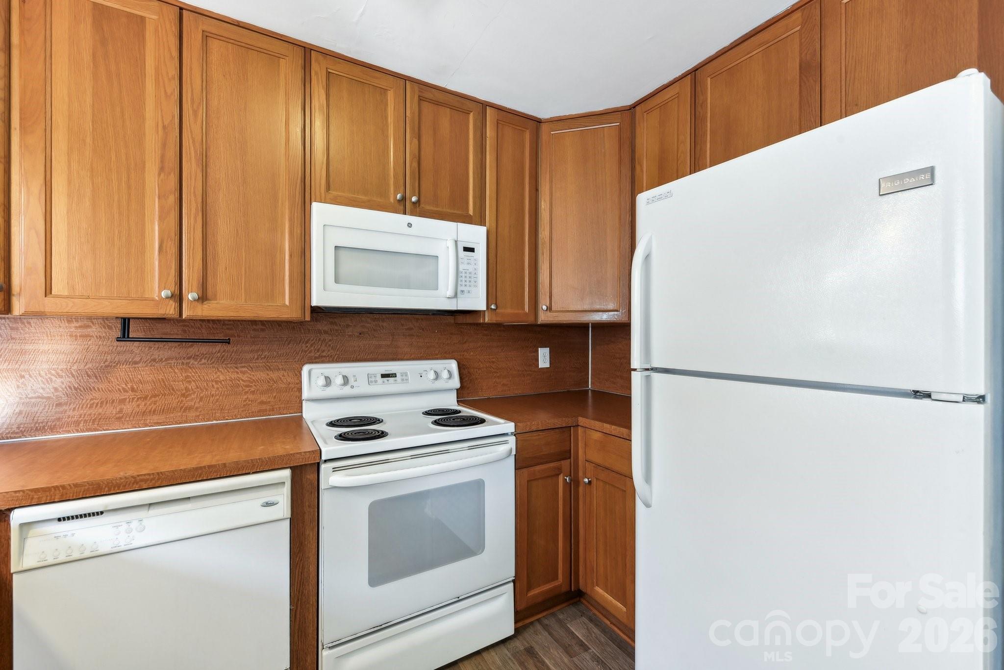 1334 Briar Creek Road, Unit 2 Charlotte, NC 28205 - Photo 10 of 30 a white refrigerator freezer sitting inside of a kitchen
