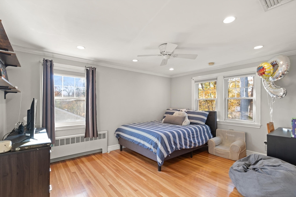 40 Friend Street Wakefield, MA 01880 - Photo 15 of 34 a bedroom with a bed and wooden floor