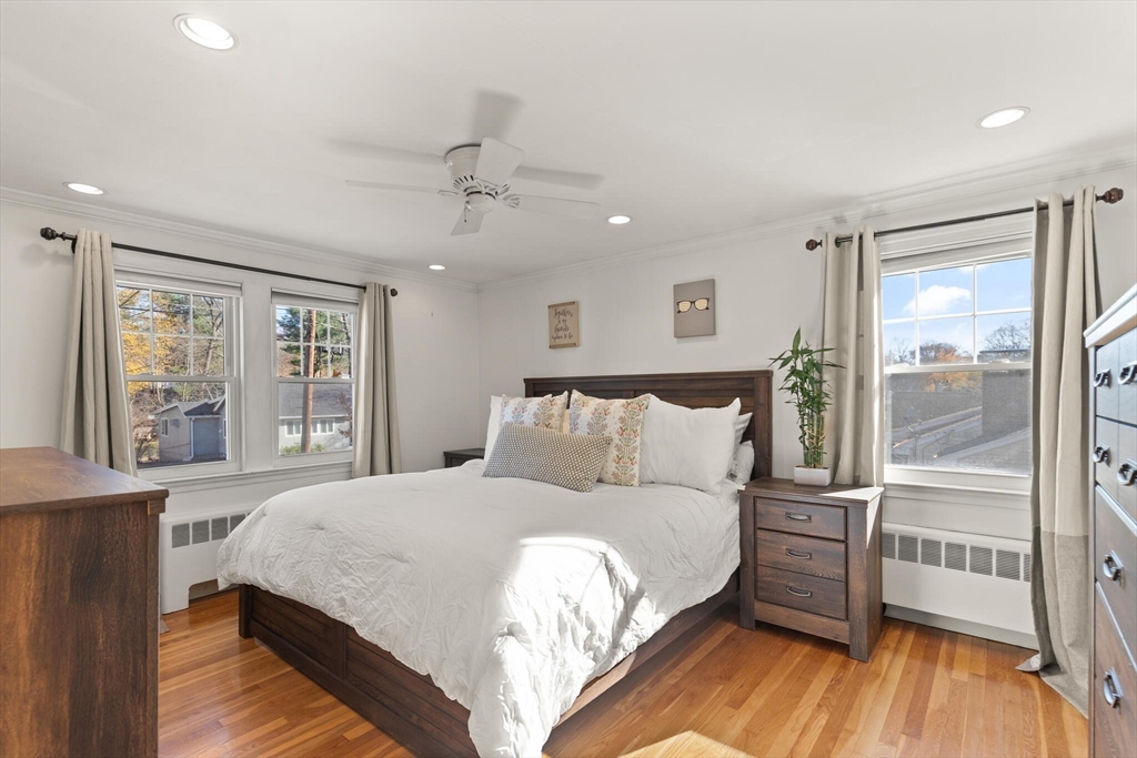 40 Friend Street Wakefield, MA 01880 - Photo 18 of 34 a large bedroom with a bed and wooden floor