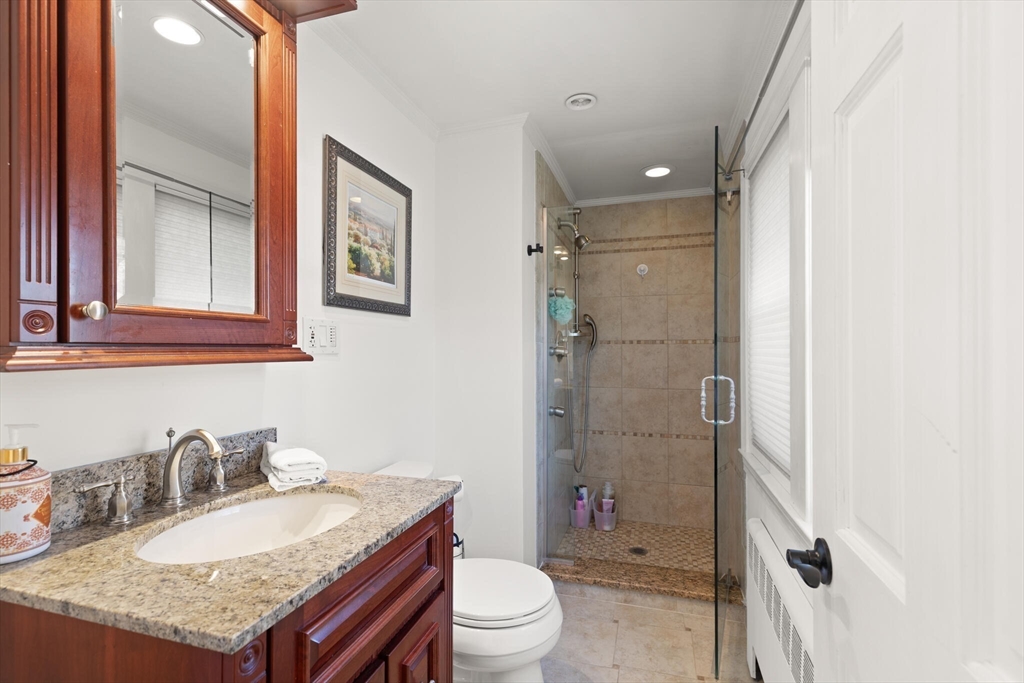 40 Friend Street Wakefield, MA 01880 - Photo 19 of 34 a bathroom with a granite countertop sink toilet and shower
