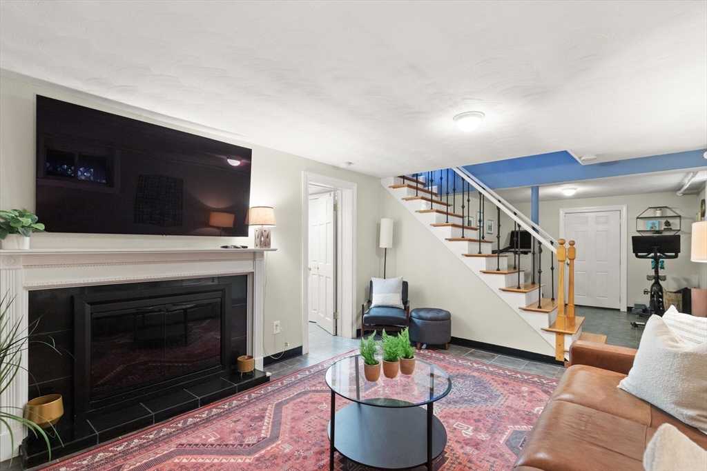 40 Friend Street Wakefield, MA 01880 - Photo 23 of 34 a living room with furniture and a fireplace