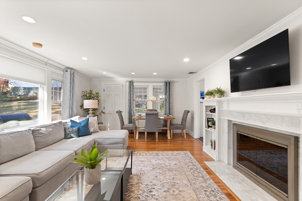 40 Friend Street Wakefield, MA 01880 - Photo 4 of 34 a living room with furniture a flat screen tv and a fireplace