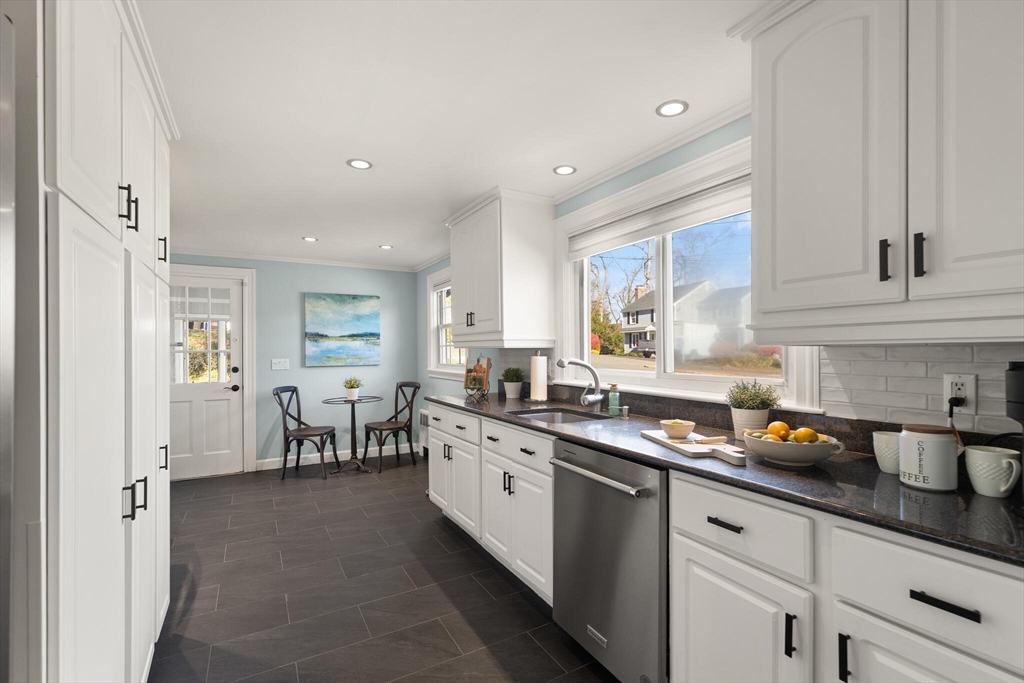 40 Friend Street Wakefield, MA 01880 - Photo 9 of 34 a kitchen with appliances a sink and cabinets