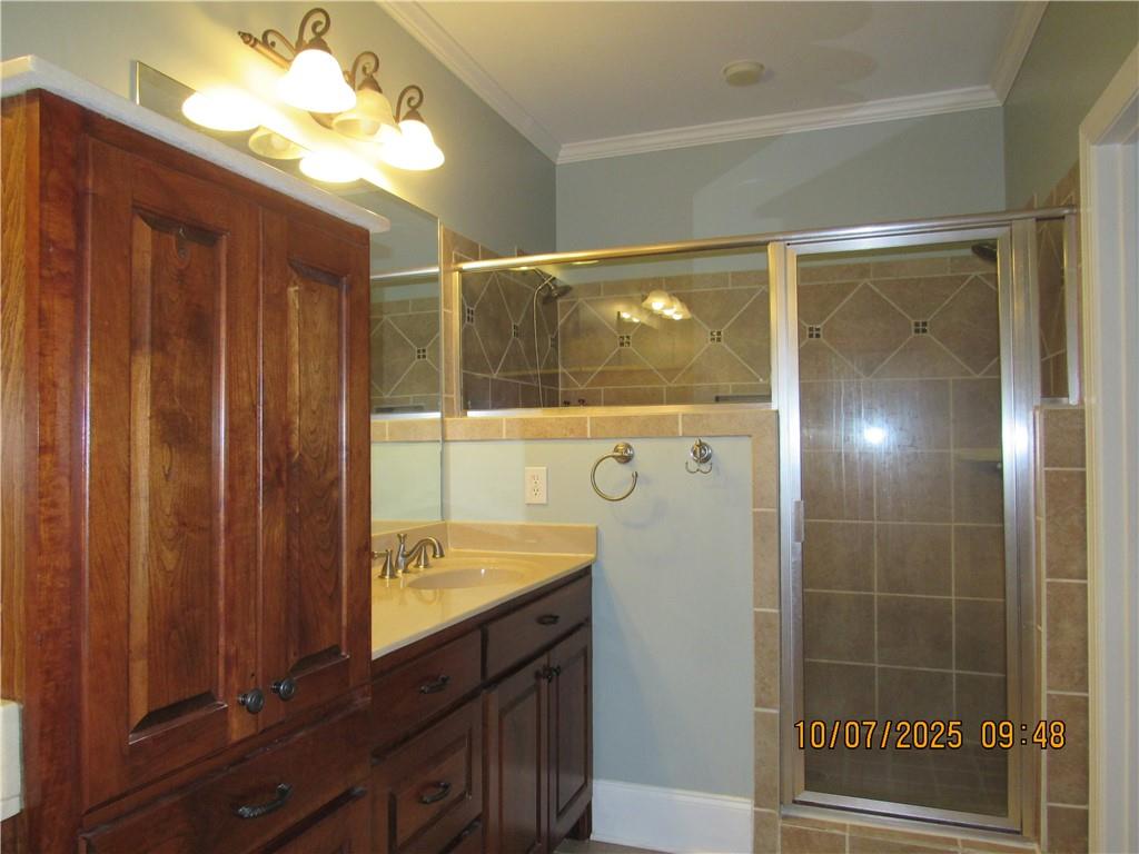 815 Spring View Court Covington, GA 30014 - Photo 12 of 43 a bathroom with a shower and a sink