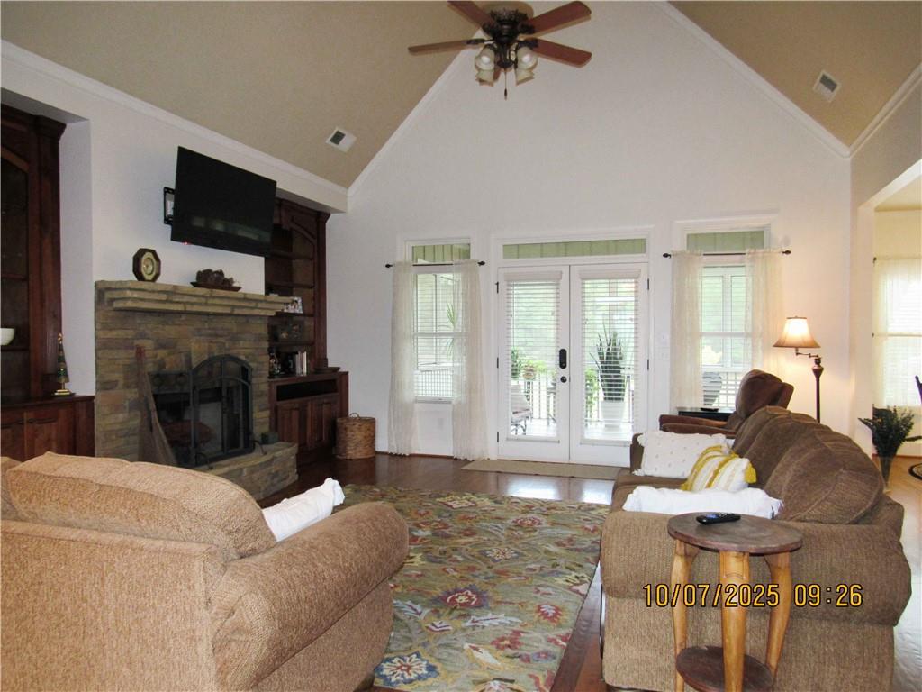 815 Spring View Court Covington, GA 30014 - Photo 16 of 43 a living room with furniture a flat screen tv and a fireplace