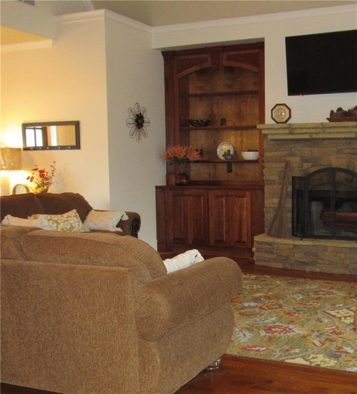 815 Spring View Court Covington, GA 30014 - Photo 20 of 43 a living room with furniture and a flat screen tv