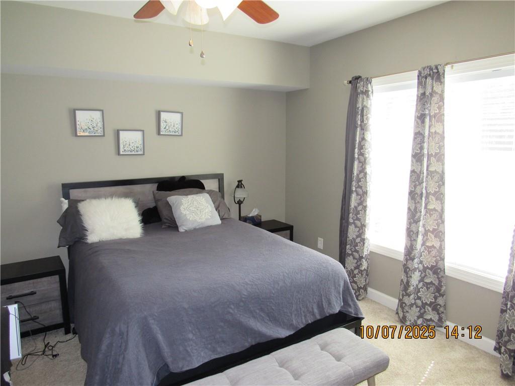 815 Spring View Court Covington, GA 30014 - Photo 27 of 43 a bedroom with a bed and a window