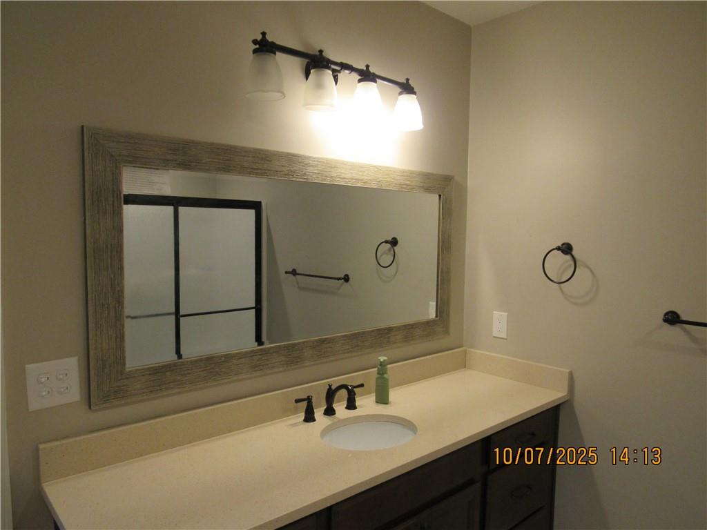 815 Spring View Court Covington, GA 30014 - Photo 30 of 43 a bathroom with a sink and a mirror