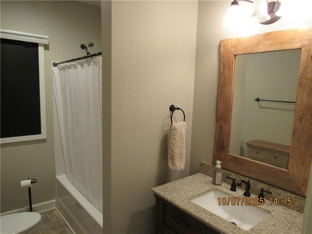 815 Spring View Court Covington, GA 30014 - Photo 38 of 43 a bathroom with a sink vanity and a mirror