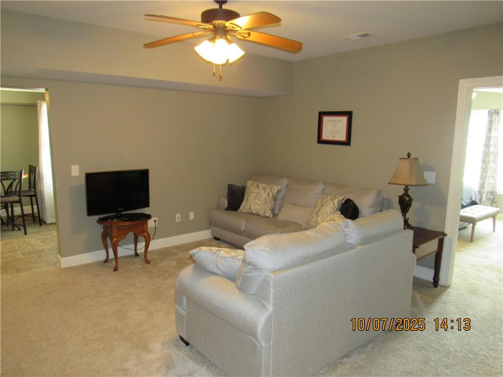 815 Spring View Court Covington, GA 30014 - Photo 40 of 43 a living room with furniture and a flat screen tv