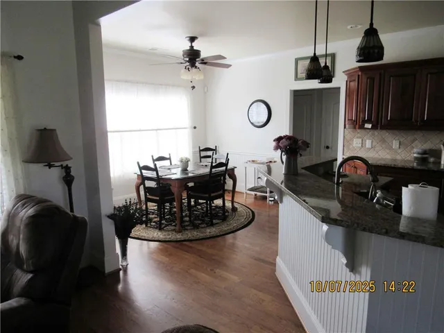 a kitchen with a sink appliances and cabinets