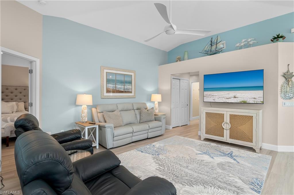 20771 Persimmon Place Estero, FL 33928 - Photo 15 of 50 a living room with furniture and a fireplace