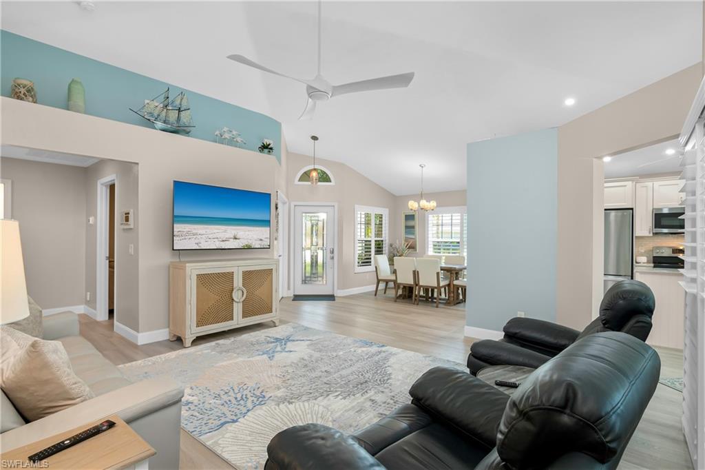 20771 Persimmon Place Estero, FL 33928 - Photo 17 of 50 a living room with furniture and a fireplace