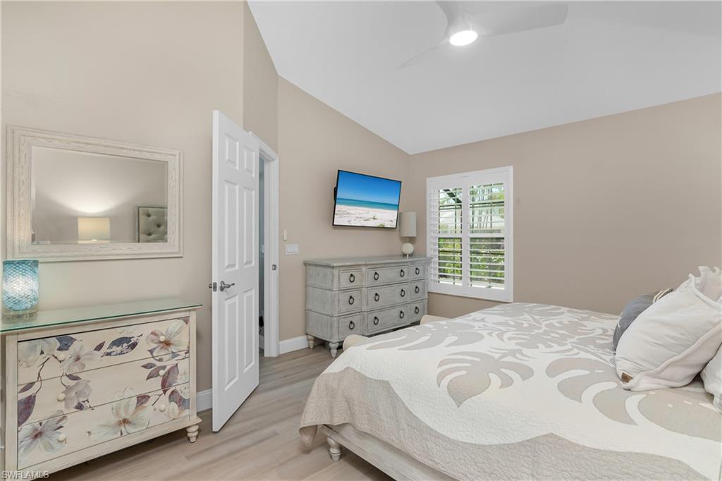 20771 Persimmon Place Estero, FL 33928 - Photo 20 of 50 a bedroom with a bed and a window
