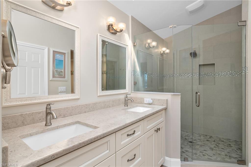20771 Persimmon Place Estero, FL 33928 - Photo 21 of 50 a bathroom with a sink double vanity and shower