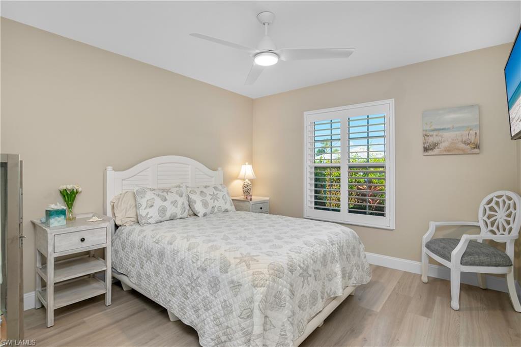 20771 Persimmon Place Estero, FL 33928 - Photo 22 of 50 a bedroom with a bed and chair