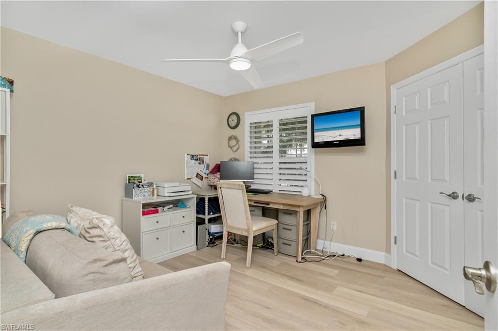 20771 Persimmon Place Estero, FL 33928 - Photo 23 of 50 a work room with furniture and wooden floor