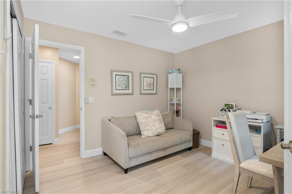 20771 Persimmon Place Estero, FL 33928 - Photo 24 of 50 a living room with furniture and a couch