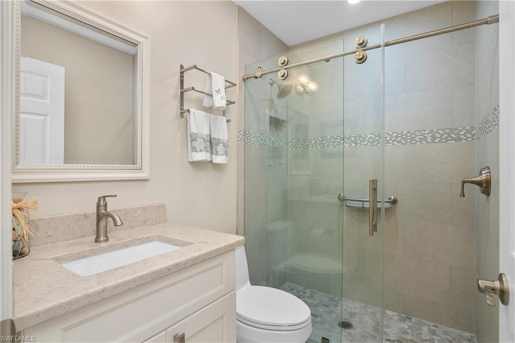 20771 Persimmon Place Estero, FL 33928 - Photo 25 of 50 a bathroom with a sink toilet and shower
