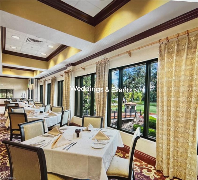 20771 Persimmon Place Estero, FL 33928 - Photo 39 of 50 a view of a dining room with furniture large windows and wooden floor