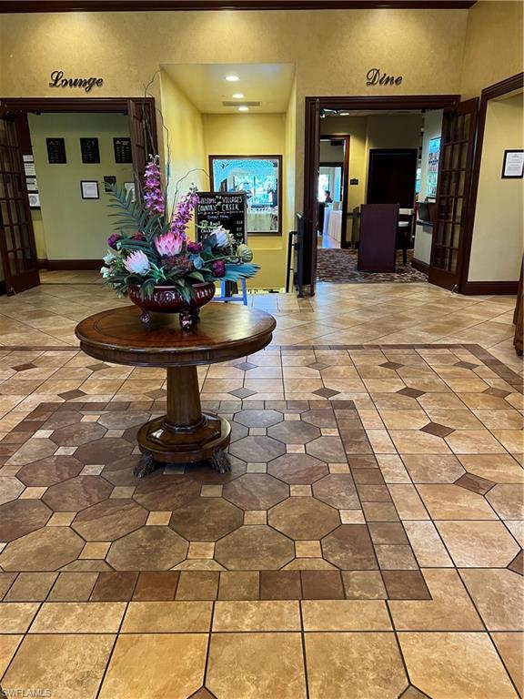 20771 Persimmon Place Estero, FL 33928 - Photo 41 of 50 a lobby with furniture and a fireplace