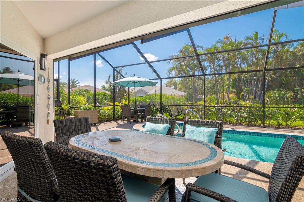 20771 Persimmon Place Estero, FL 33928 - Photo 5 of 50 a view of a patio with a table chairs and a backyard