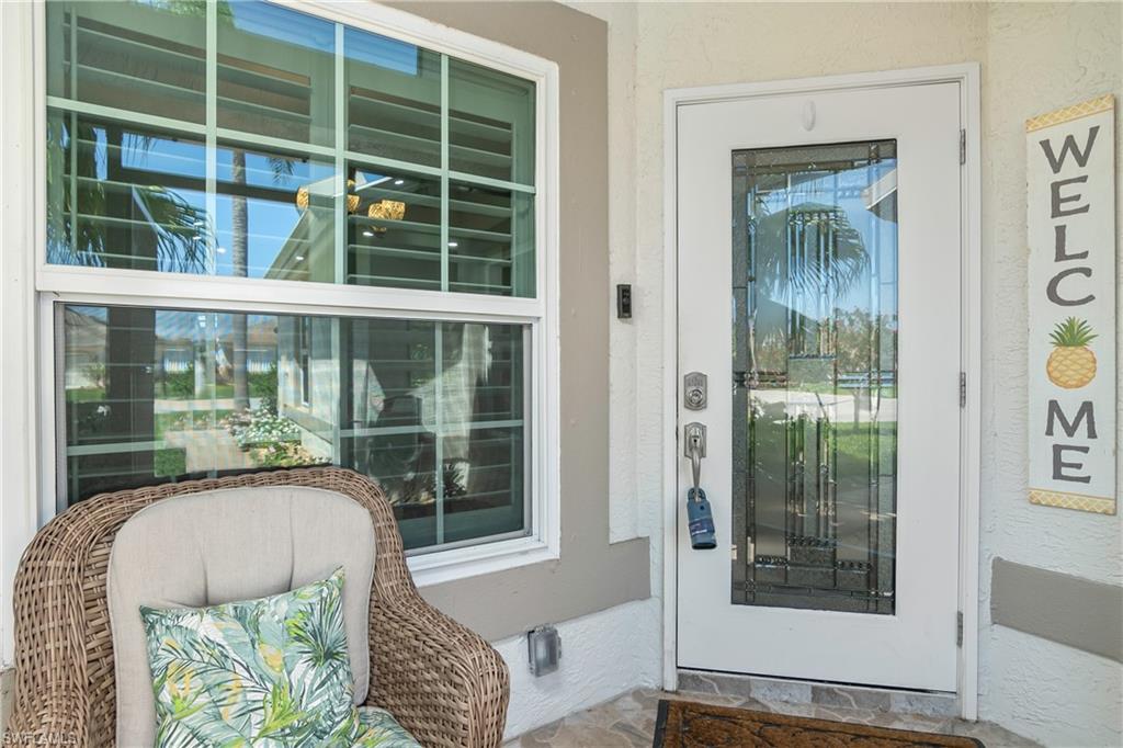 20771 Persimmon Place Estero, FL 33928 - Photo 7 of 50 a living room with furniture and a window