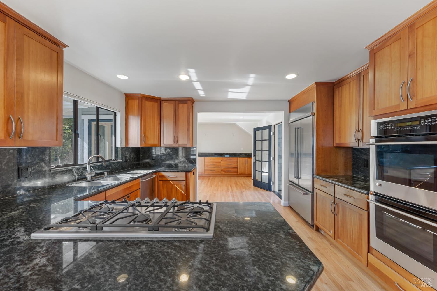 500 Ridge Road Tiburon, CA 94920 - Photo 15 of 42 a large kitchen with stainless steel appliances granite countertop a large counter top and a stove