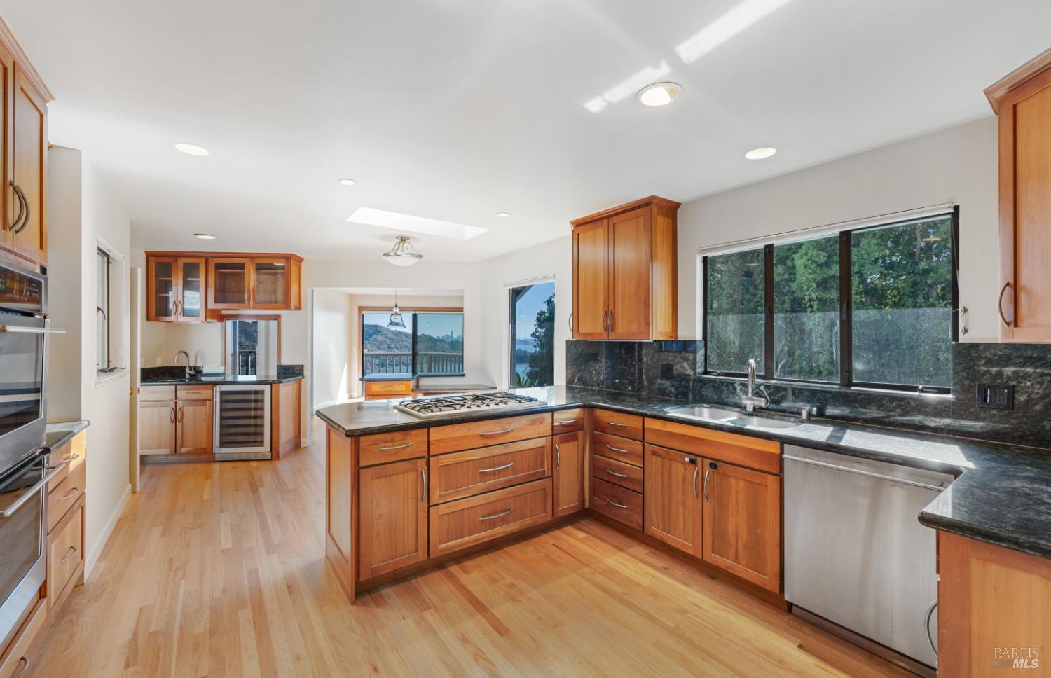 500 Ridge Road Tiburon, CA 94920 - Photo 16 of 42 a kitchen with lots of counter top space and wooden floor