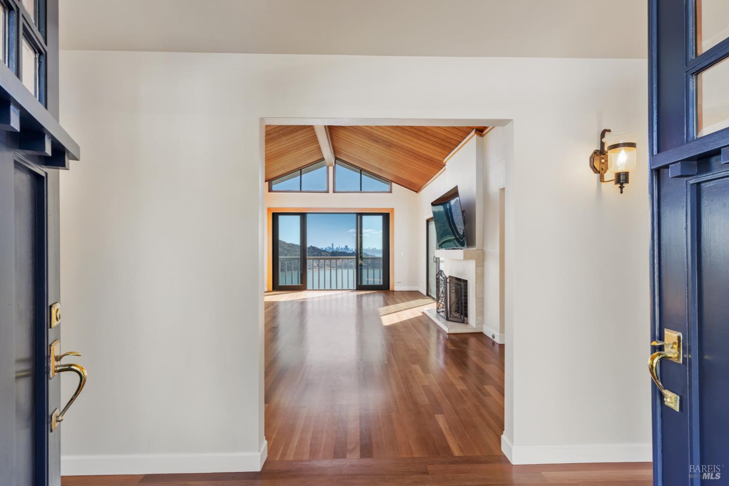 500 Ridge Road Tiburon, CA 94920 - Photo 8 of 42 a view of empty room with wooden floor and fireplace