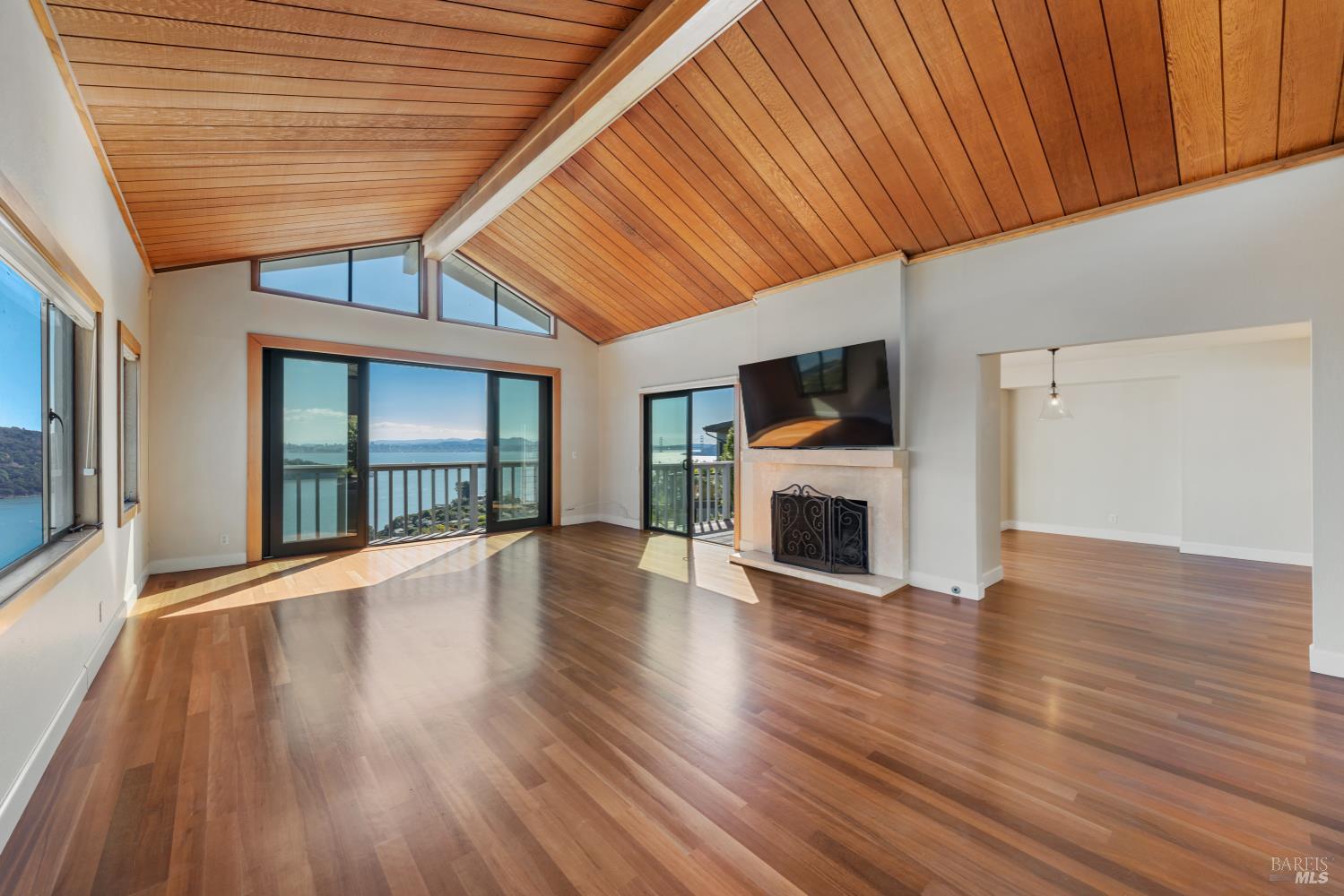 500 Ridge Road Tiburon, CA 94920 - Photo 9 of 42 a view of a livingroom with wooden floor and a fireplace