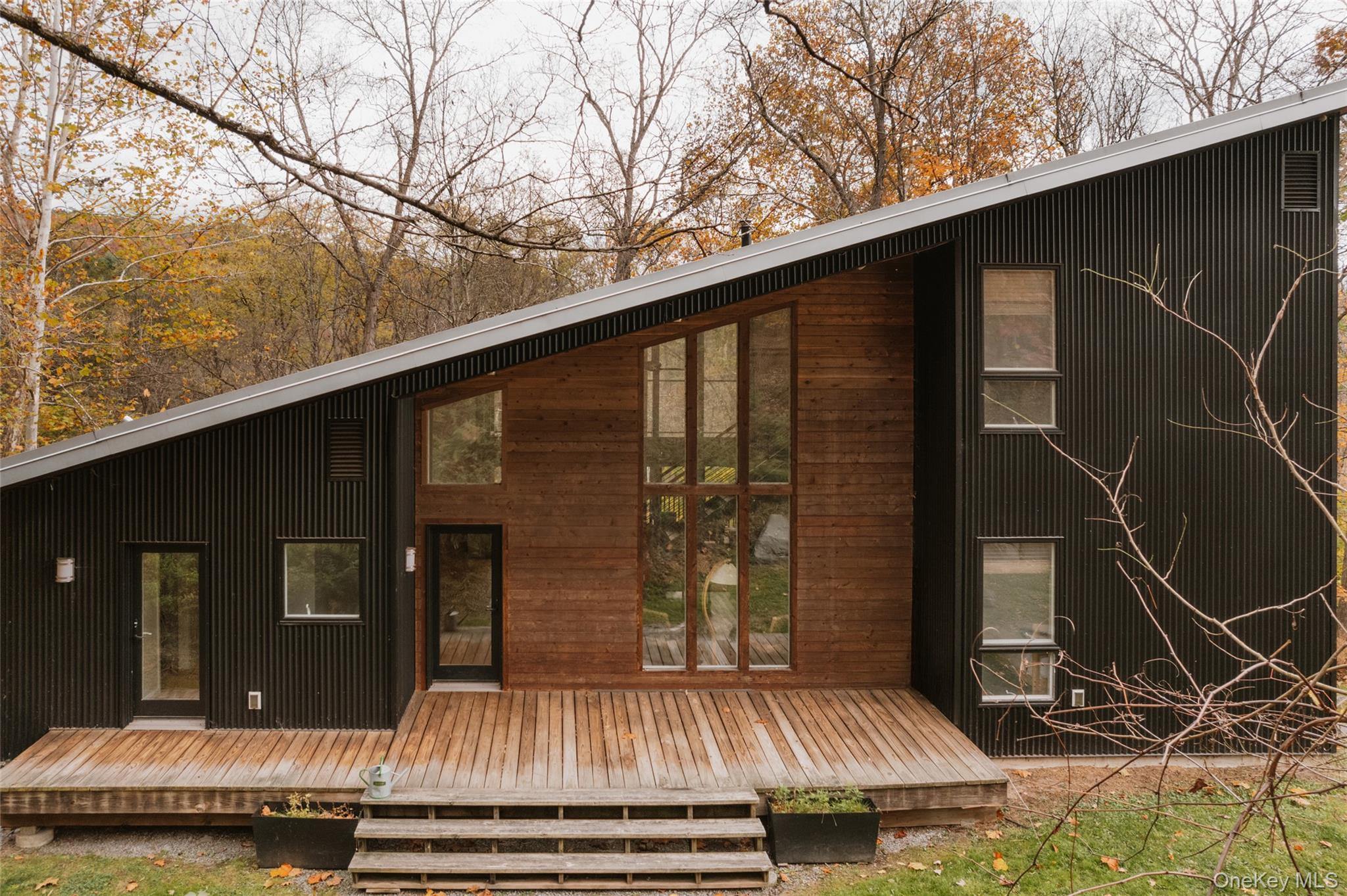 a view of backyard with roof deck