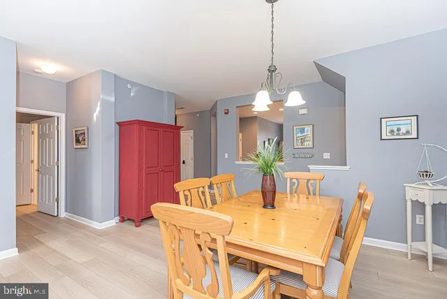 a dining room with a table and chairs