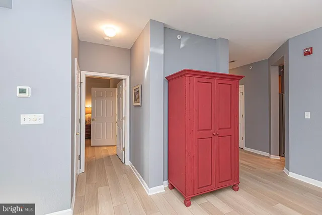 an entryway with wooden floor